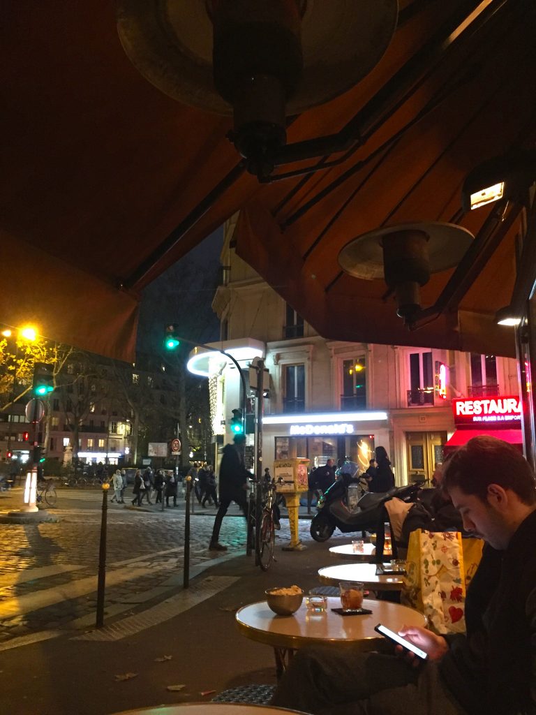sitting on heated terrasse on chilly Paris night