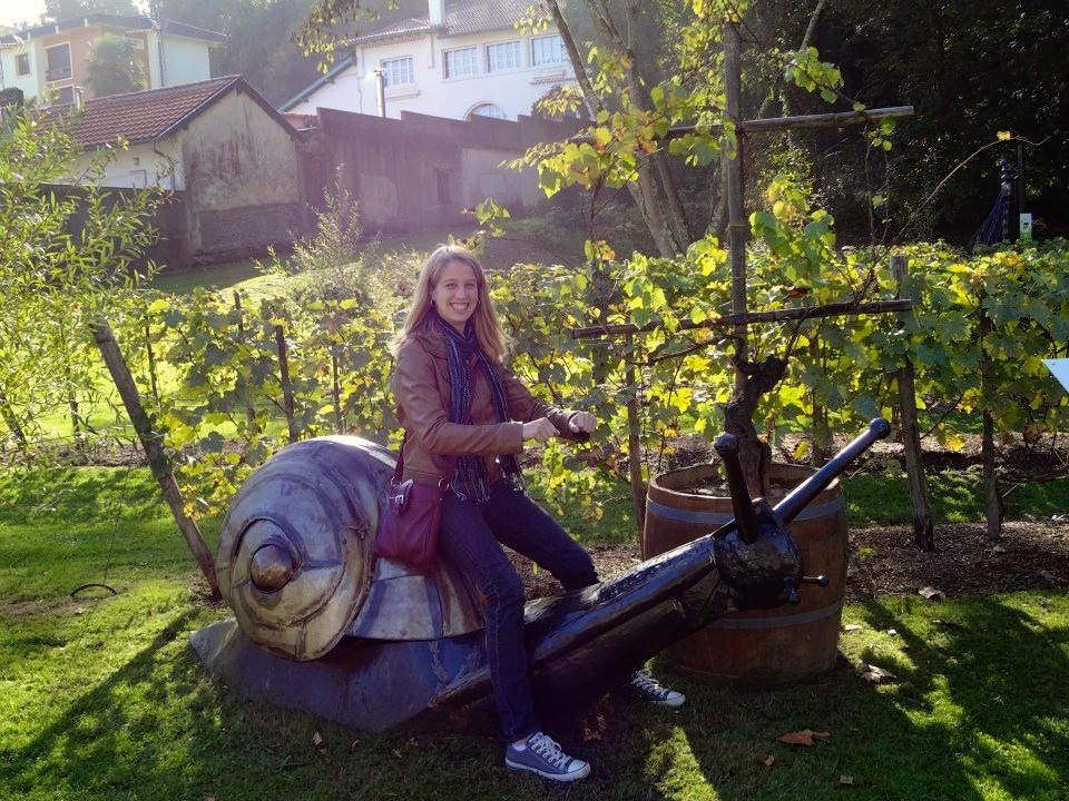 sitting on an escargot statue