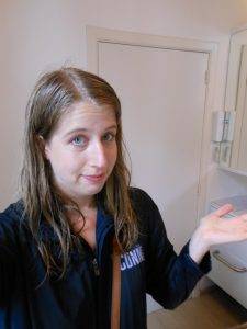 woman with wet hair after getting caught in the rain