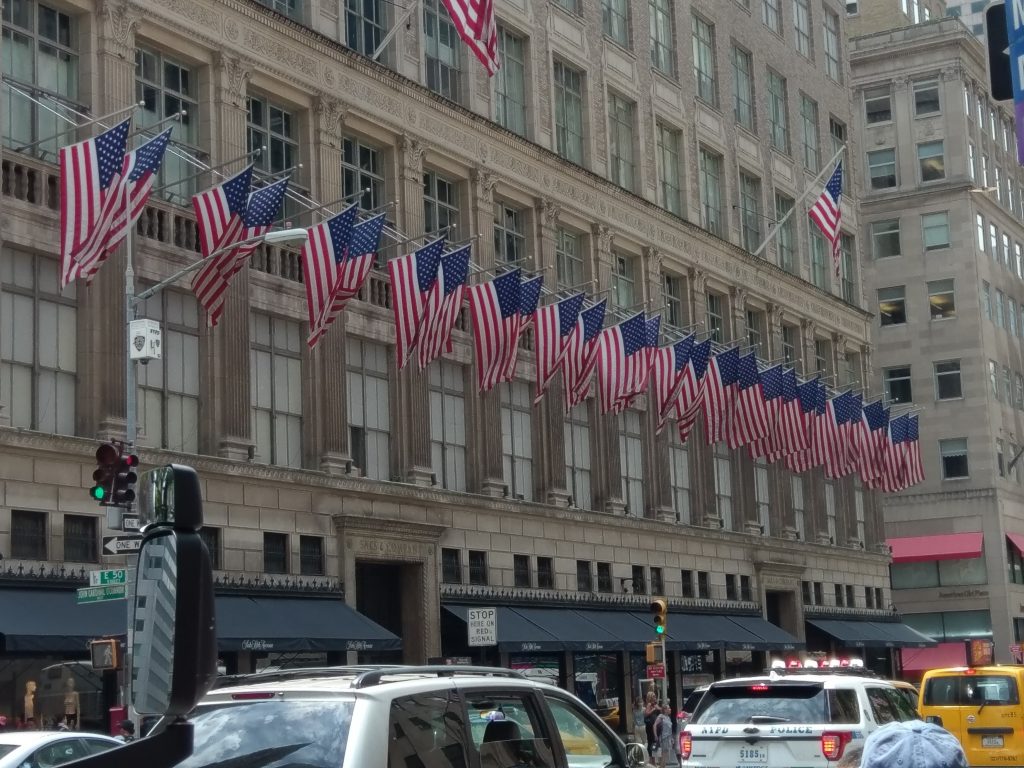 Americans flags lined up on a building in New York City