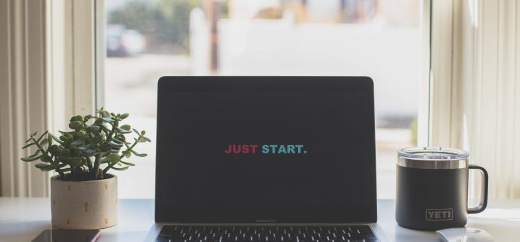 From French Teacher to Expat Blogger computer opened with message: Just Start.