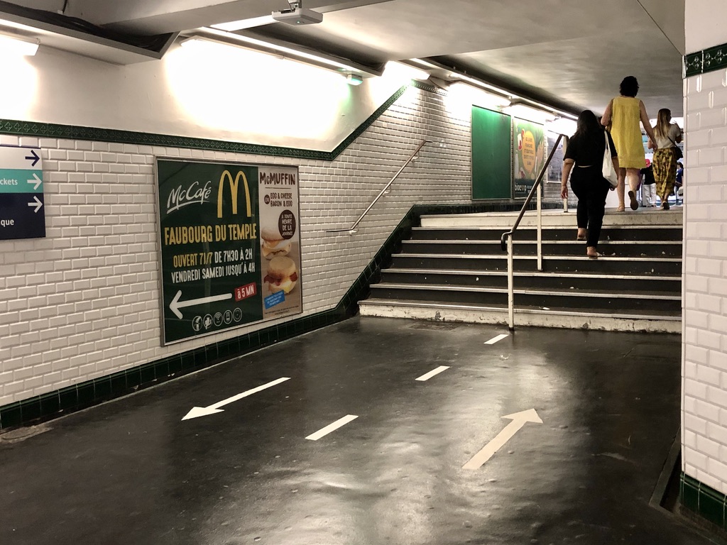 arrows on the ground of the metro station to encourage flow of people