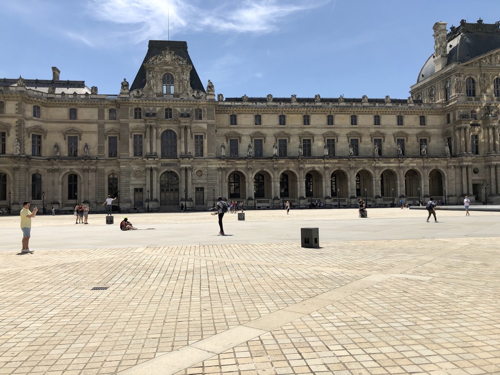 empty space in front of the Louvre museum on a sunny afternoon