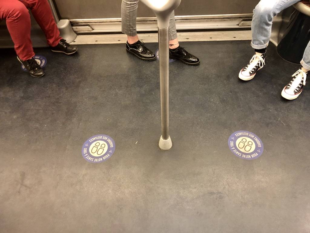 stickers on the floor of the metro car to encourage spacing between people