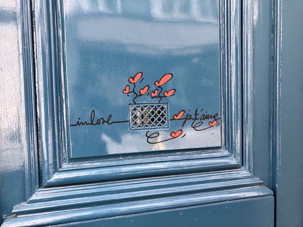 in love paris street art blue door