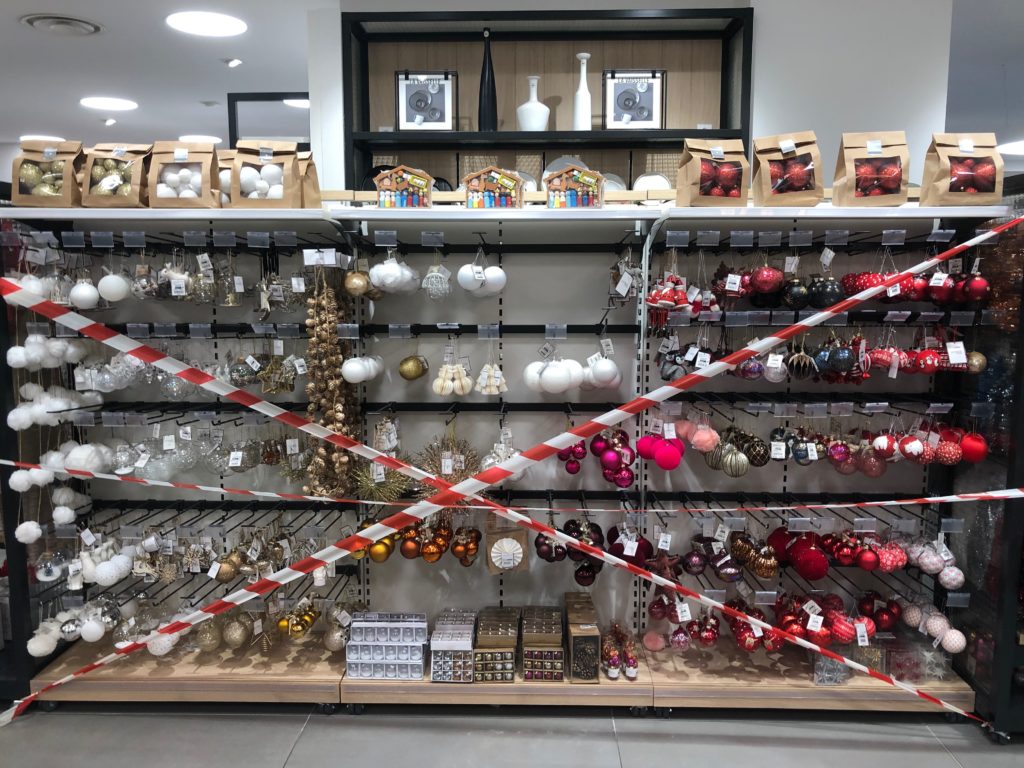 Christmas ornaments on shelved, taped off during confinement in France