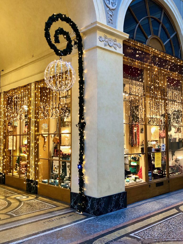 Inside Galerie Vivienne decorated with white lights Christmas 2020