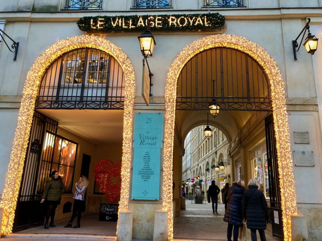 entrance to Le Village Royal outlined in white lights, Christmas 2020