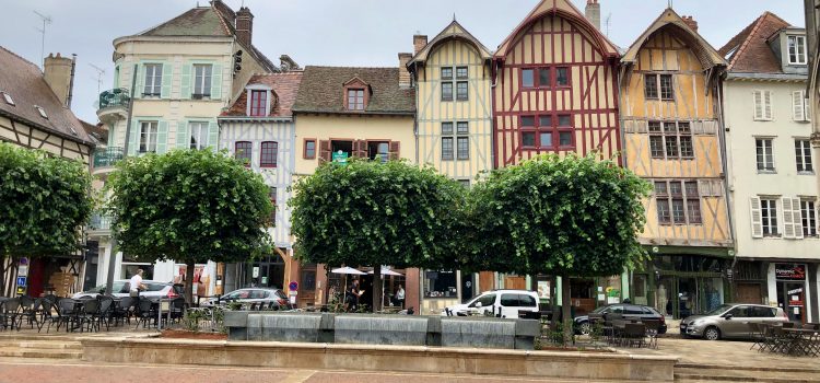 a row of half-timbered and colorful houses in Troyes, France