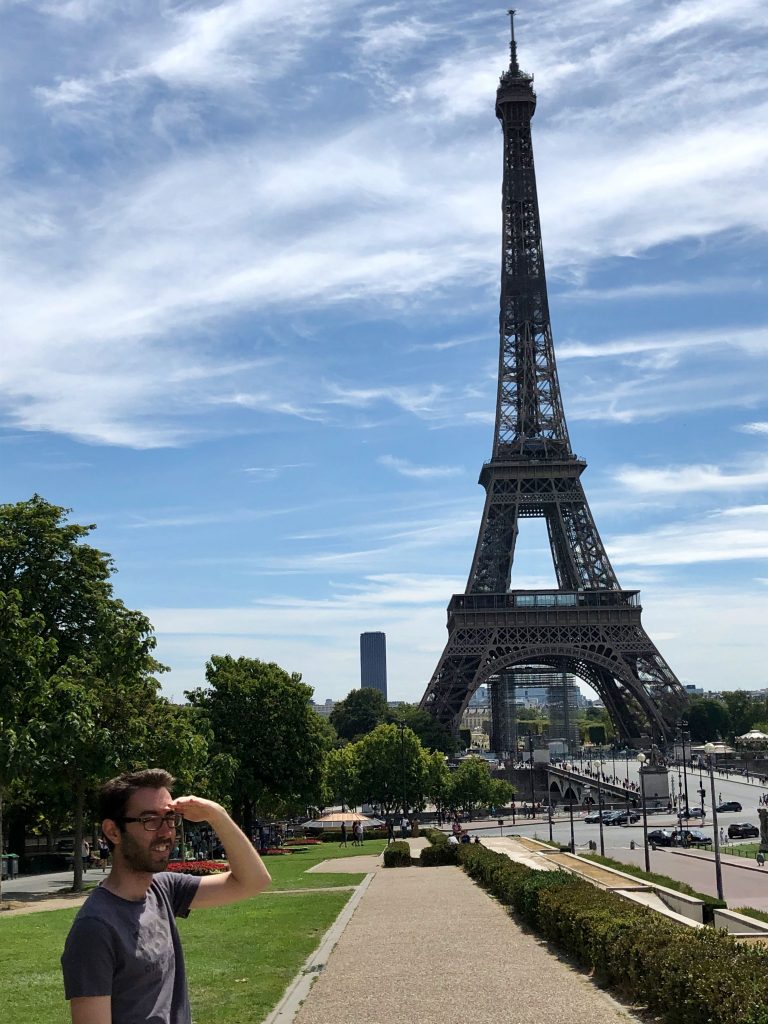 guy looking away from the Eiffel Tower