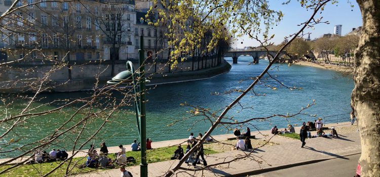 Don’t Visit Paris spring day, people sitting on the quai of the Seine River