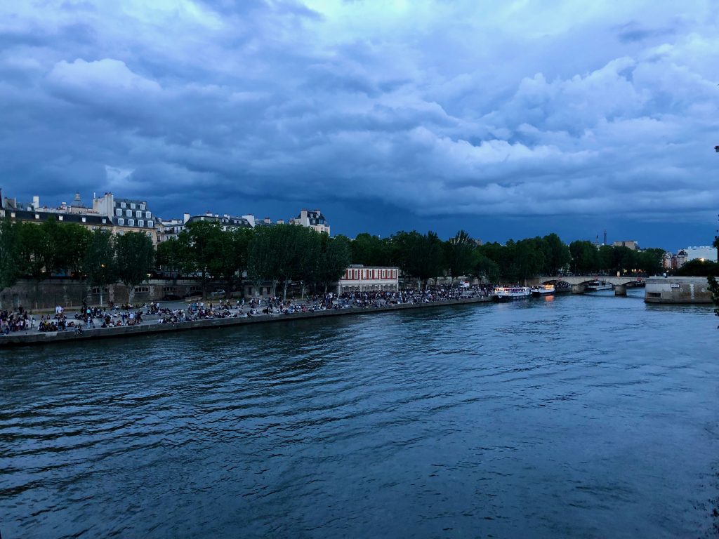 cloudy, dark, and stormy sky over Paris, view from the Seine