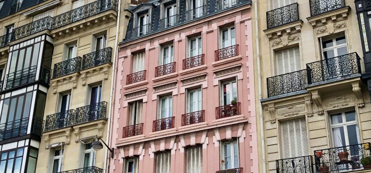 pink apartment building in Paris