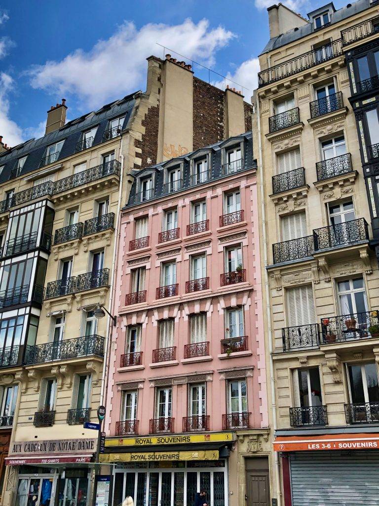 pink apartment building in Paris