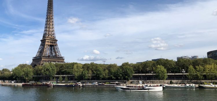 view of Eiffel Tower from Pont de Bir-Hakeim on a cloudy day