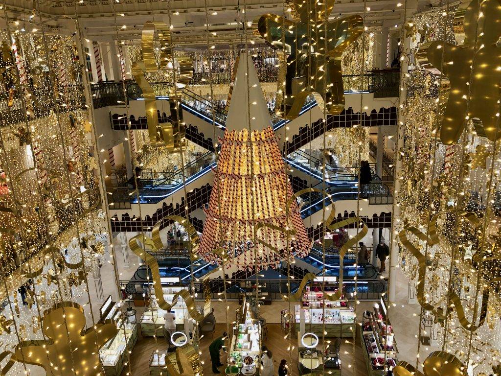 Le Bon Marché department store, Christmas 2021, gold fairy lights, golden gingerbread cookie cutters, and a candy cane tree