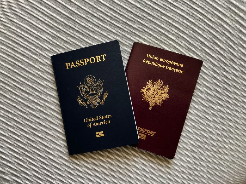 American passport and French passport side by side