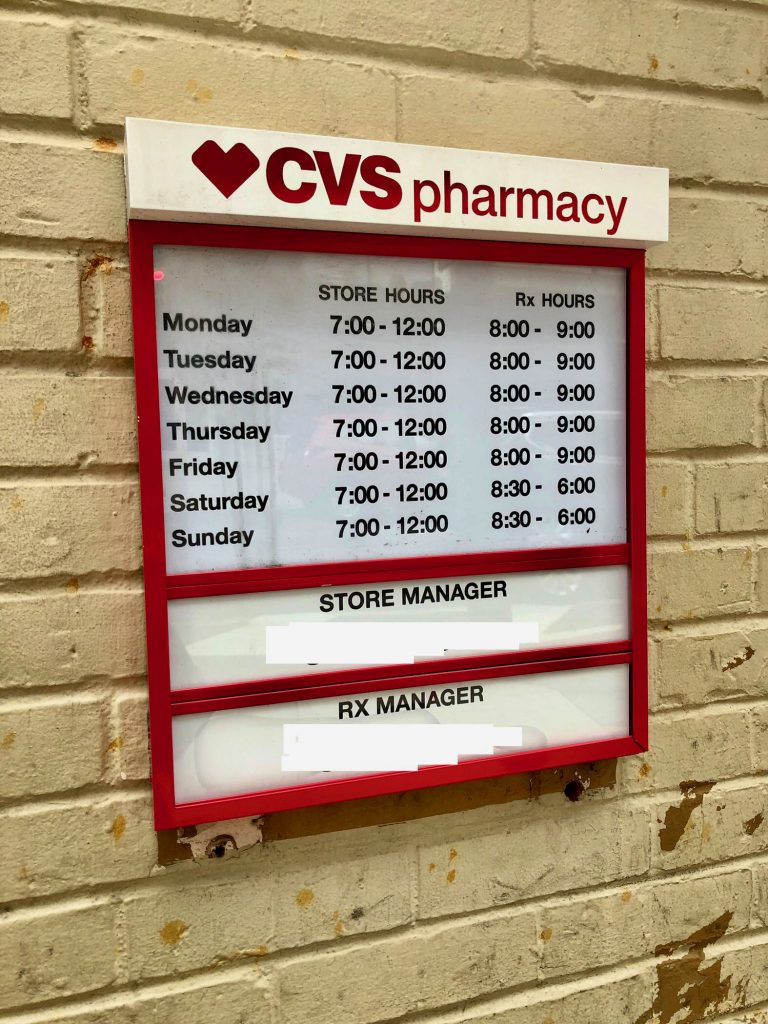 CVS pharmacy board listing store hours