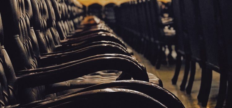 looking down the row of black leather chairs set up for jury duty