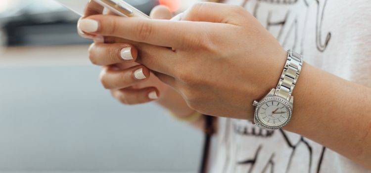 close up of woman's hands holding a smartphone