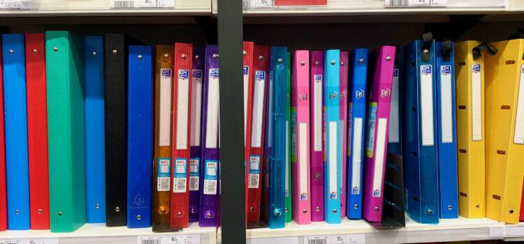 rows of colorful plastic French binders