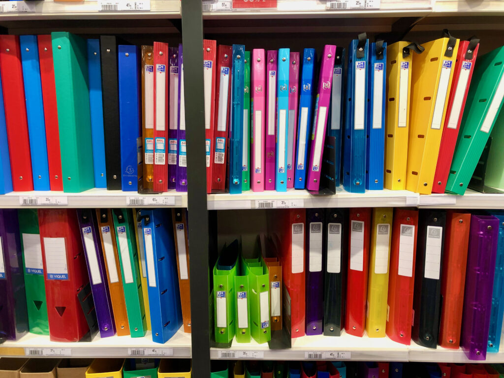 rows of colorful plastic French binders