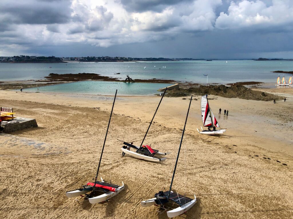 boats and an artificial swimming pool on the Bon Secours Beach