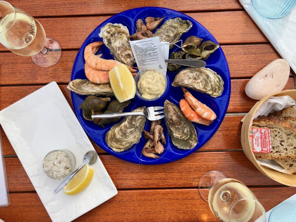 a platter of seafood including shrimp and oysters from Cancale, France