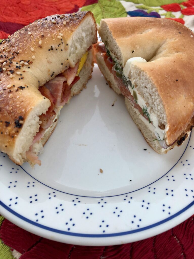 two halves of New York-style bagel breakfast sandwiches (what every American abroad misses!)