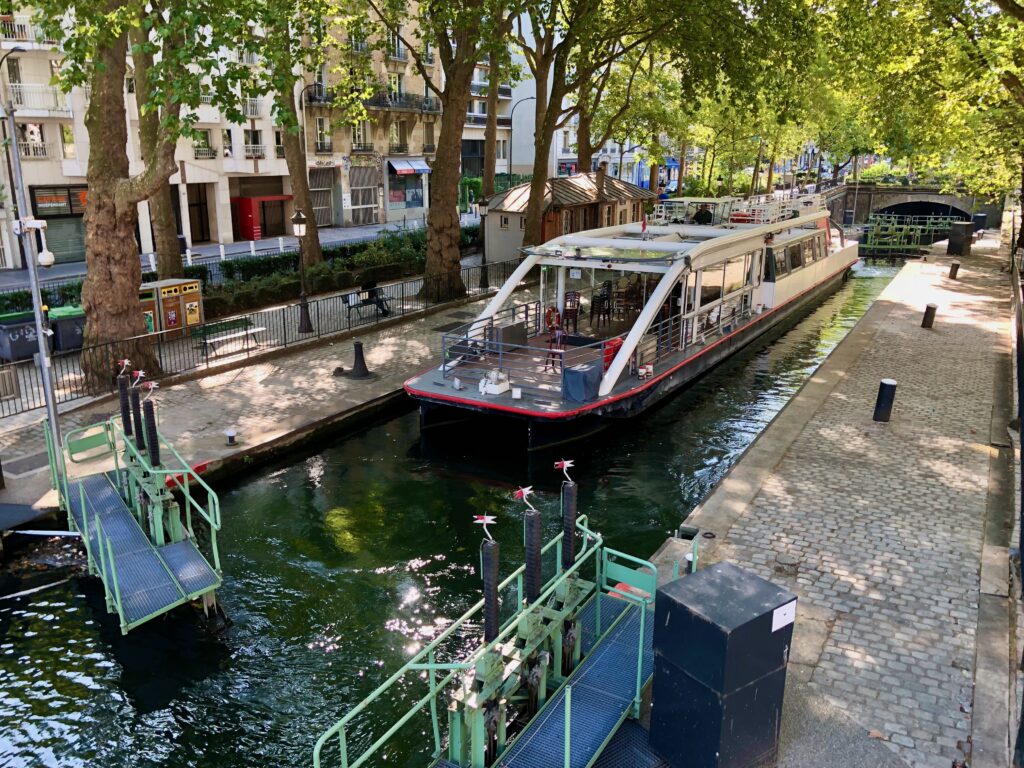 Paris boat tour in Canal Saint-Martin passing through one of the many locks