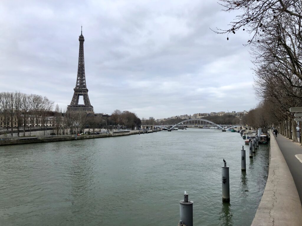 View of Eiffel Tower from across the Seine on a gray winter day in Paris