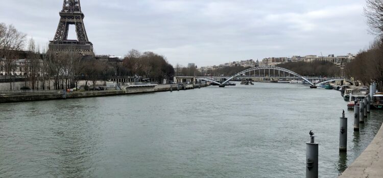 View of Eiffel Tower from across the Seine on a gray winter day in Paris