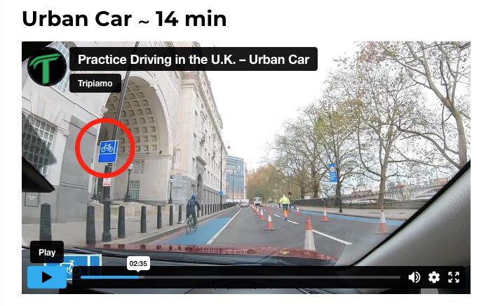 screenshot of Tripiamo 360° driving tour to learn how to drive in the UK as a tourist; view of the road from the left side of the car and a red circle around bike lane sign to draw your attention to this important road indication