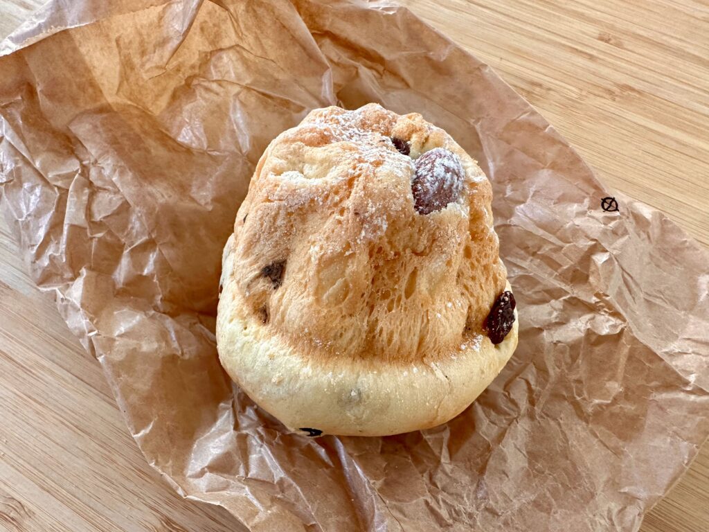 small kougelhopf, an Aslsatian brioche, with almonds, rum raisins, and dusted with powdered sugar