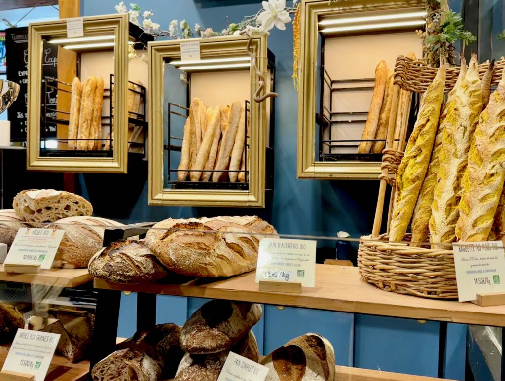 Baguettes and breads on display in a Parisian boulangerie
