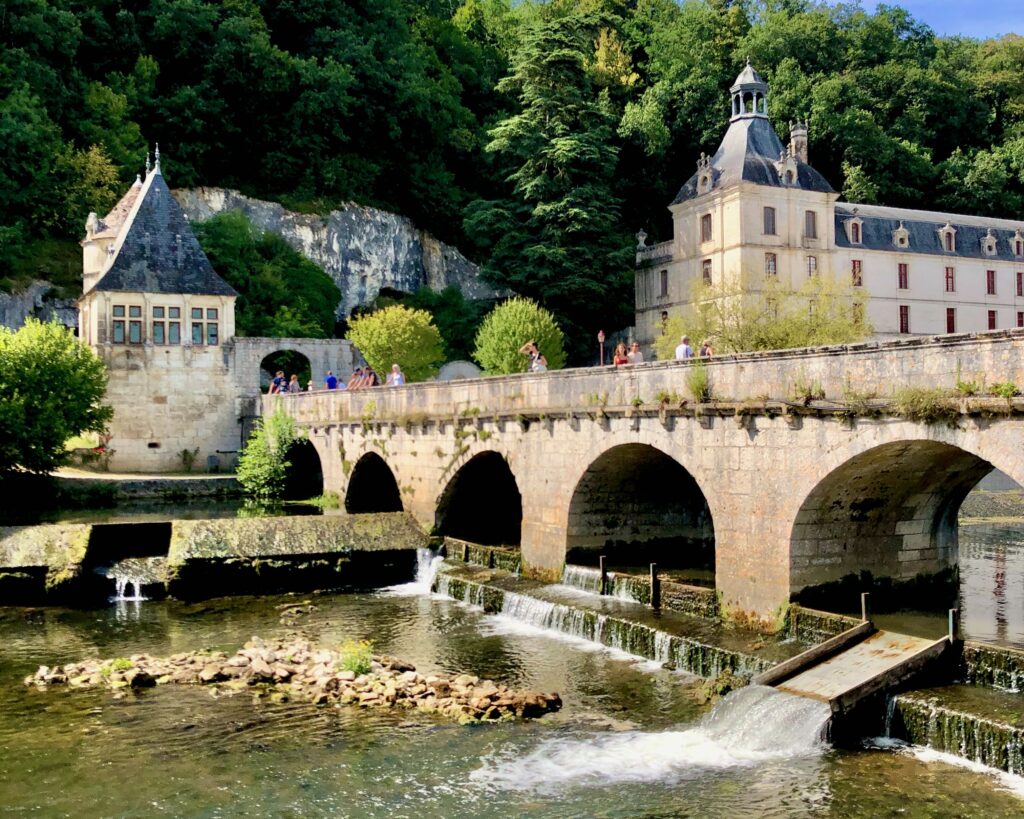 Abbaye de Brantôme seen from over Pont Coudé bridge in the Dordogne region of France