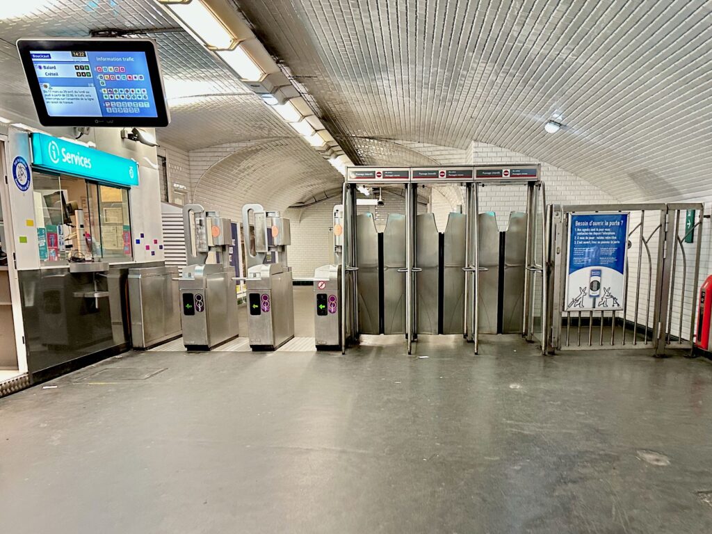 Paris metro turnstiles and gates to enter and exit