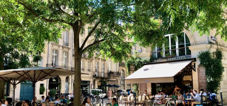 How Long Does It Take To Become Fluent in French? French people enjoying an outdoor seating area terrasse in Bordeaux, France.