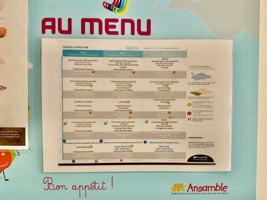 crèche daycare menu for the week on a bulletin board